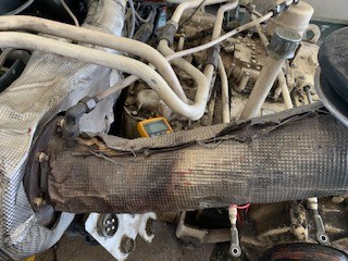 Heat shield cover damage caused by moisture